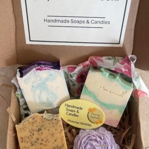 3 Soaps and a flower candle in a box